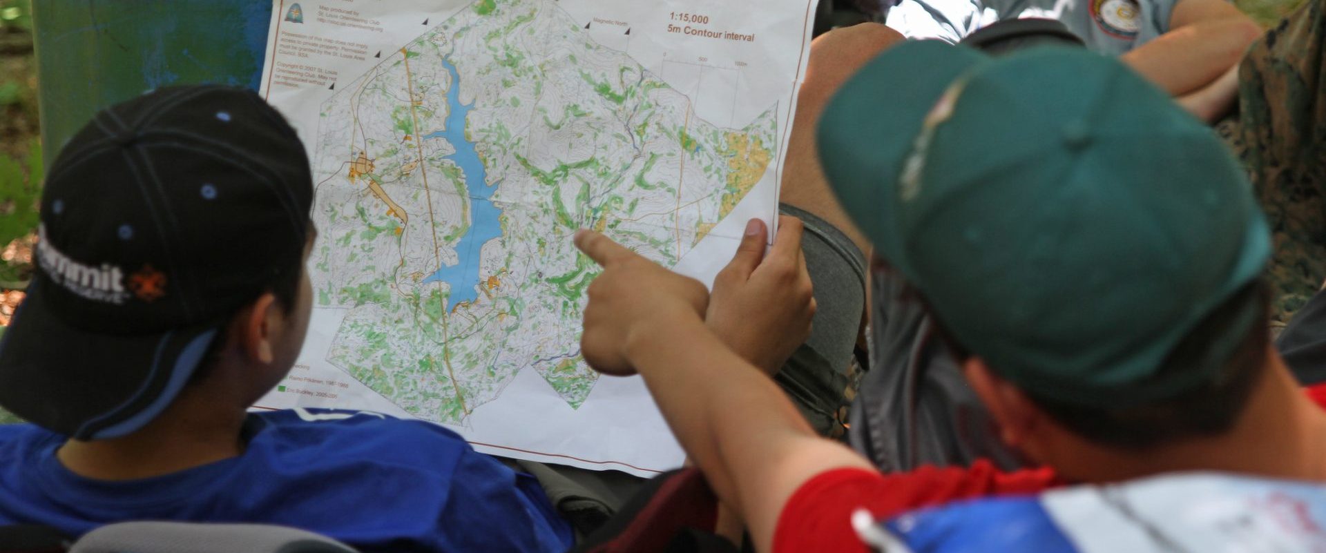 Scouts look at a map